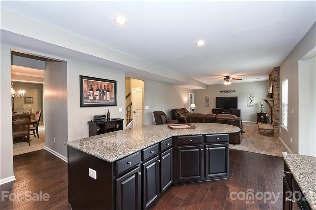 3006 Fallondale Road Waxhaw, NC 28173 - Photo 24 of 48 a kitchen with granite countertop a sink counter top space and stainless steel appliances