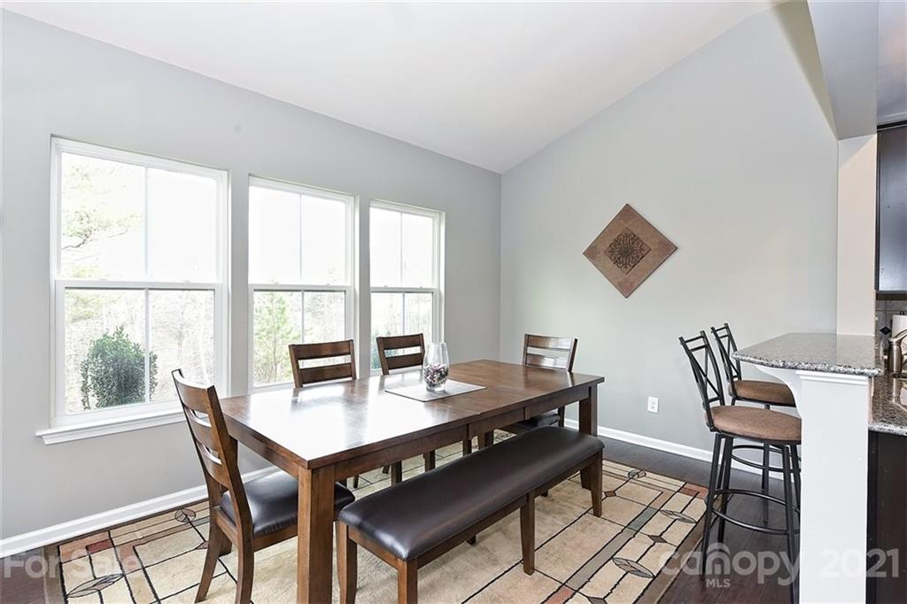 3006 Fallondale Road Waxhaw, NC 28173 - Photo 25 of 48 a view of a dining room with a table and chairs