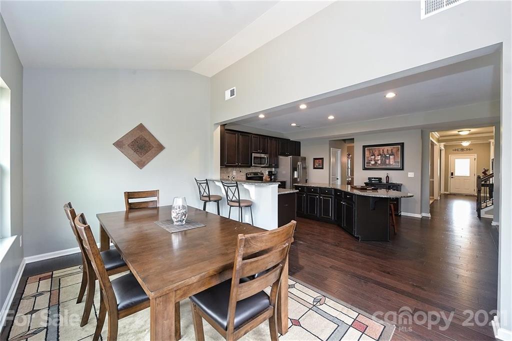 3006 Fallondale Road Waxhaw, NC 28173 - Photo 26 of 48 a dining area with furniture and wooden floor