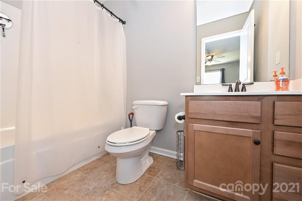 3006 Fallondale Road Waxhaw, NC 28173 - Photo 29 of 48 a bathroom with a toilet sink and mirror