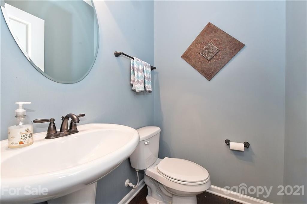 3006 Fallondale Road Waxhaw, NC 28173 - Photo 31 of 48 a bathroom with a toilet a sink and mirror