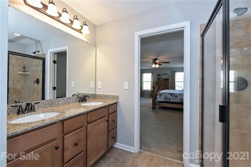3006 Fallondale Road Waxhaw, NC 28173 - Photo 35 of 48 a en suite bathroom with a double sink and mirror