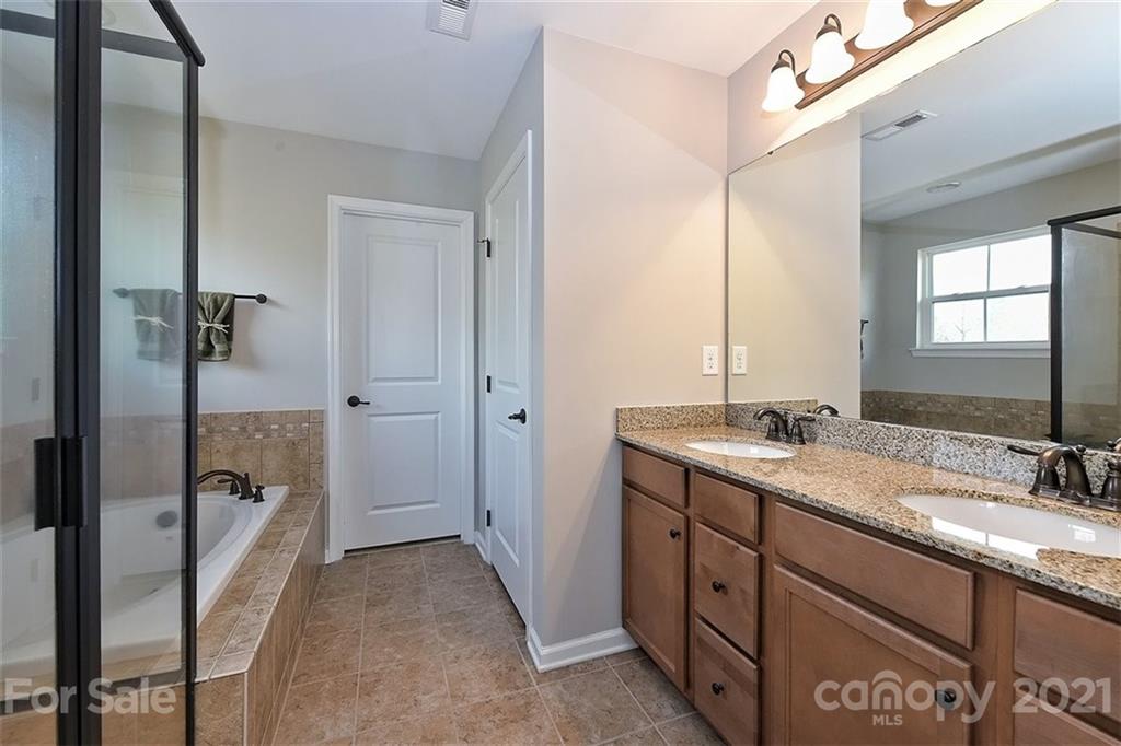 3006 Fallondale Road Waxhaw, NC 28173 - Photo 36 of 48 a bathroom with a sink a toilet and shower
