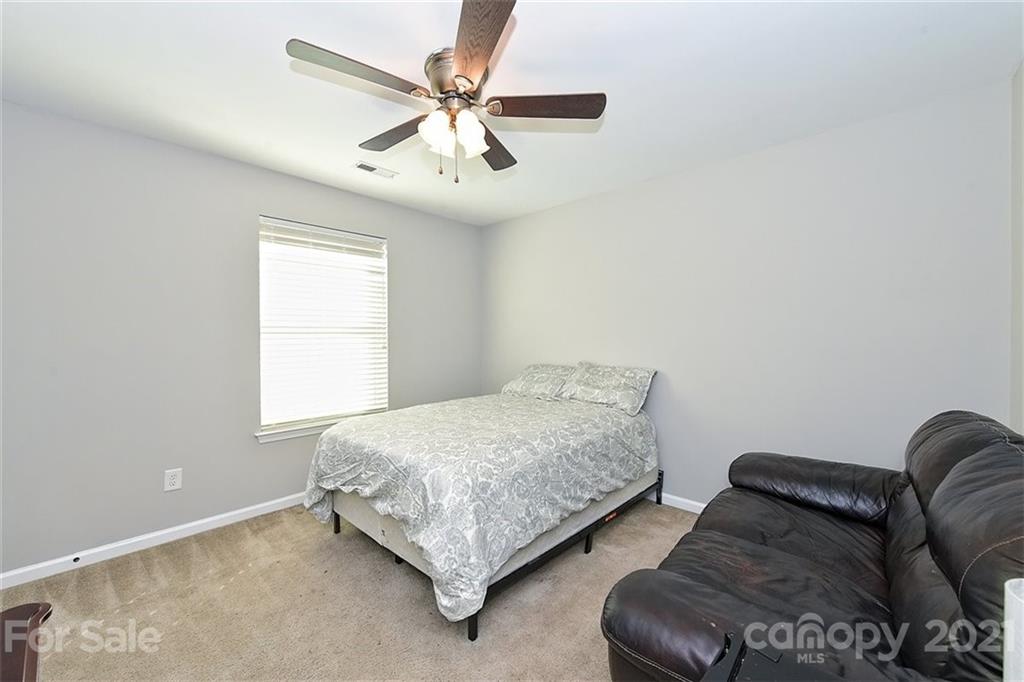 3006 Fallondale Road Waxhaw, NC 28173 - Photo 38 of 48 a bedroom with bed and a window