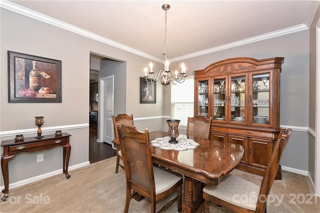 3006 Fallondale Road Waxhaw, NC 28173 - Photo 9 of 48 a view of a dining room with furniture and chandelier