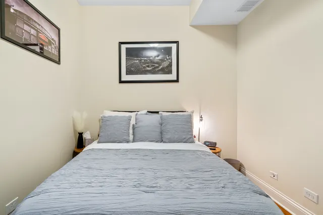 a large bed in a white room