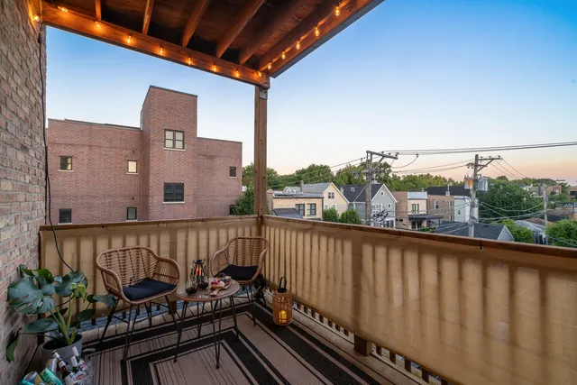 a view of a balcony with wooden floor