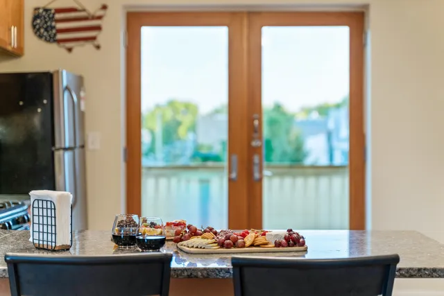 a table and chairs in roof of a room