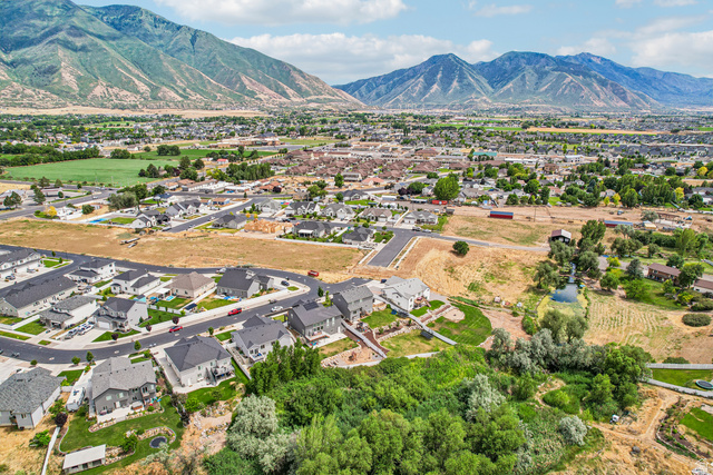 203 North 1900th Street West Mapleton, UT 84664 - Photo 45 of 48 Expansive mountain range backdrop framing a residential community with varied home styles