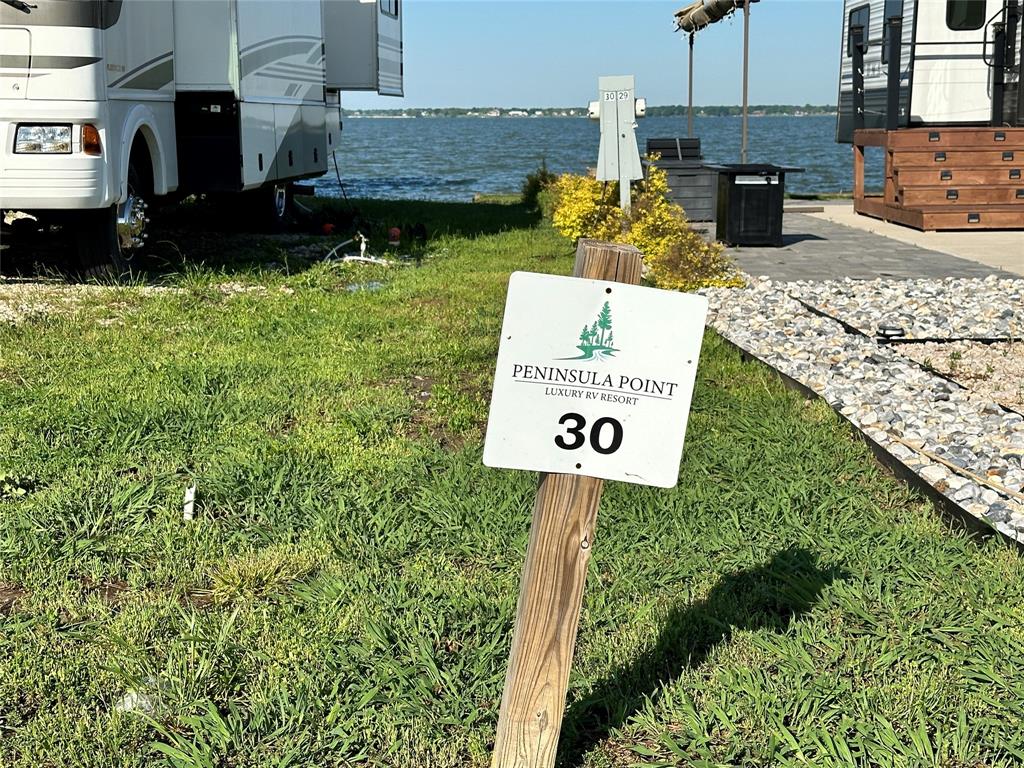 5132 Waterfront Road Kerens, TX 75144 - Photo 9 of 40 a view of a street with potted plants