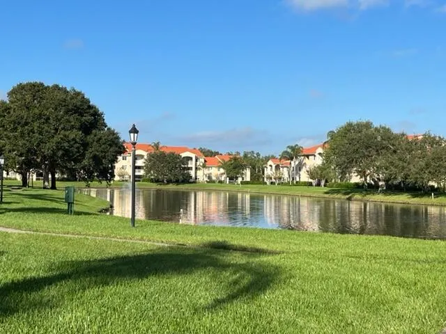 a view of a lake with a house in the background