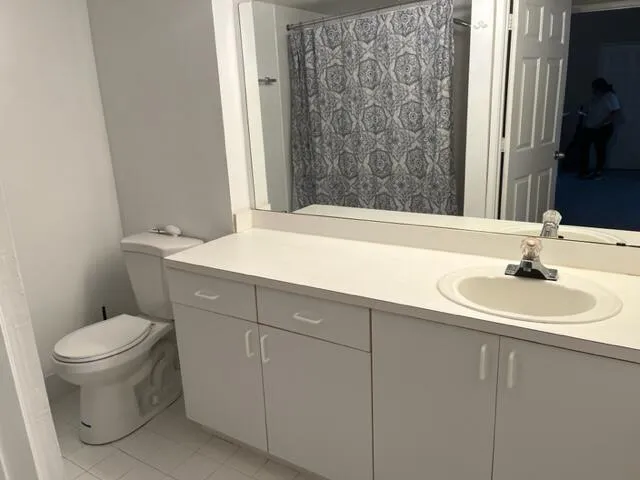 a kitchen with a refrigerator sink and stove