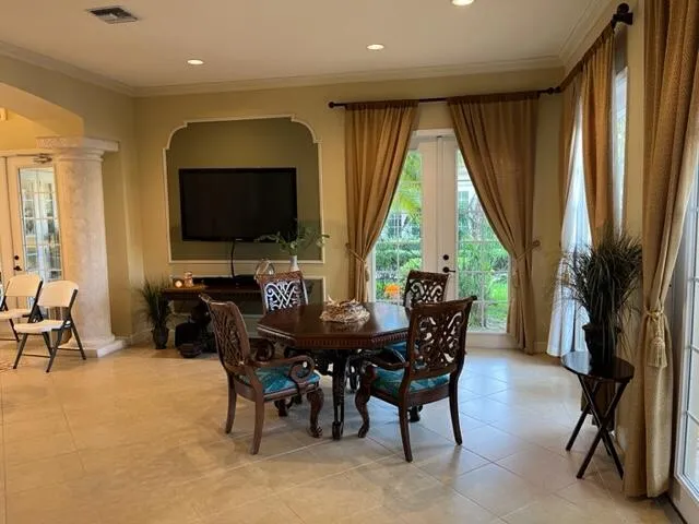 a view of a dining room with furniture window and outside view