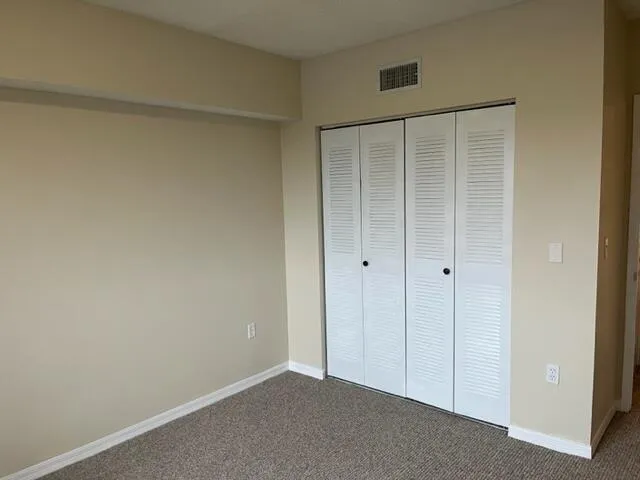 a white toilet sitting next to a shower curtain