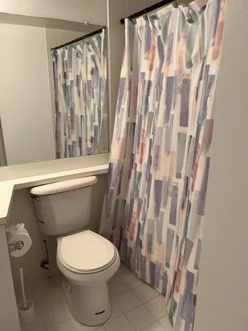 a kitchen with a refrigerator and a sink