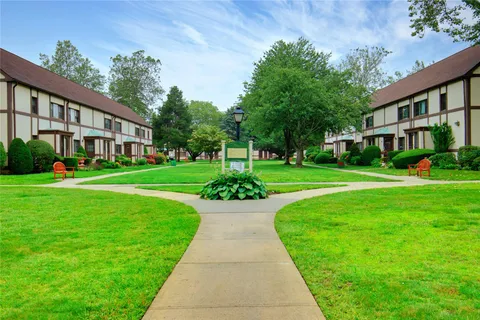 a view of an apartment with a garden