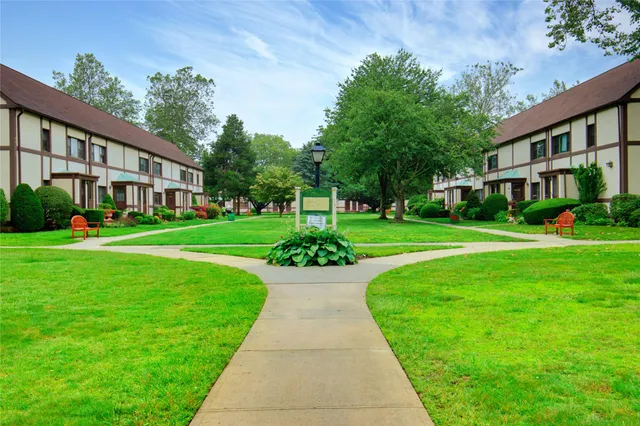 a view of an apartment with a garden