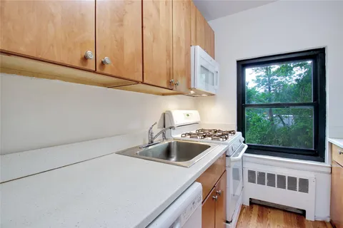 a kitchen that has a stove and a microwave