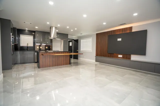 a view of kitchen with refrigerator sink and microwave