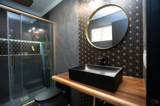 a bathroom with a toilet and a mirror