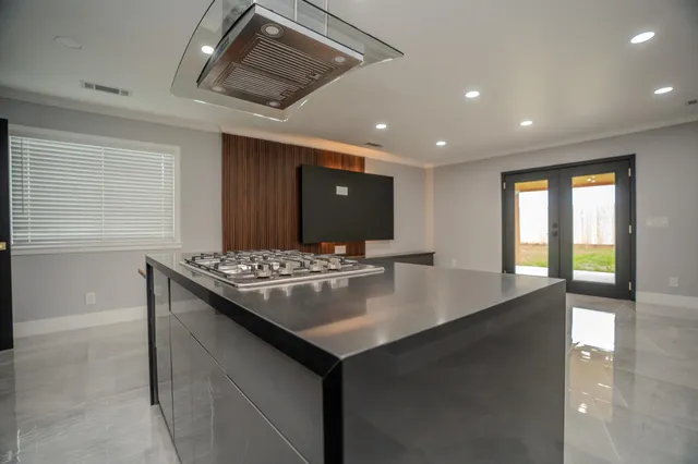 a kitchen with a sink and a refrigerator
