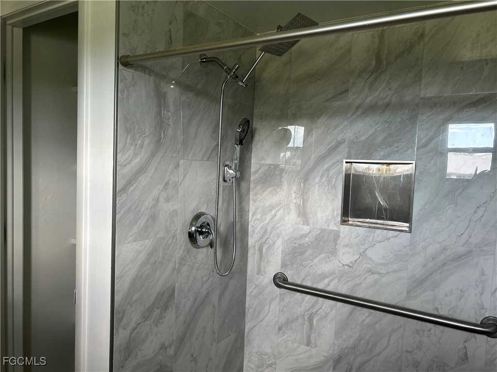 729 Southwest 46th Street Cape Coral, FL 33914 - Photo 13 of 20 a bathroom with a shower