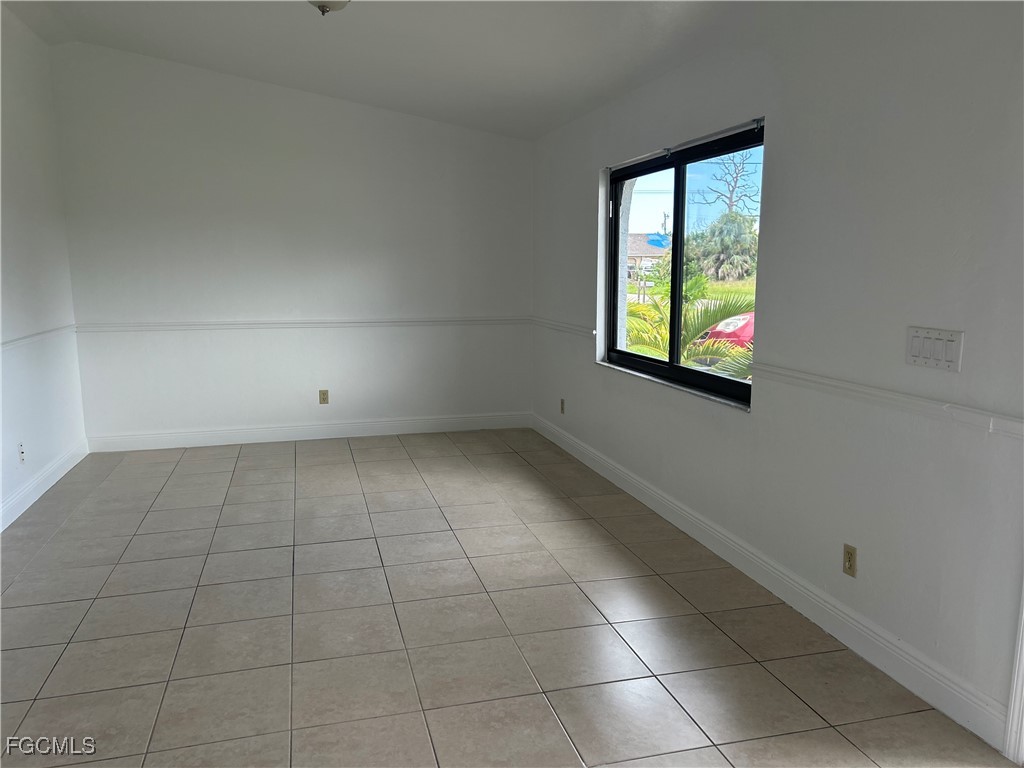 729 Southwest 46th Street Cape Coral, FL 33914 - Photo 18 of 20 a view of an empty room with a window