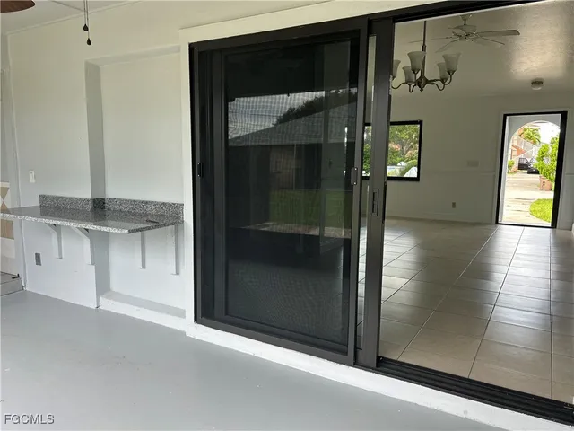 a view of a car in front of a building