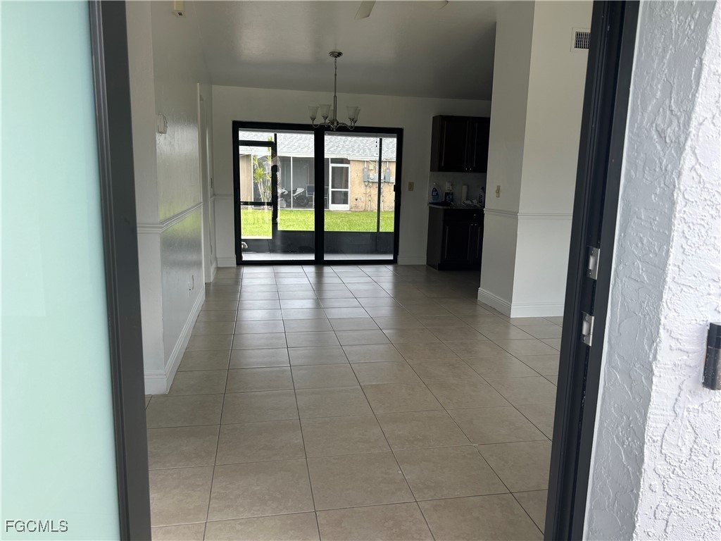 729 Southwest 46th Street Cape Coral, FL 33914 - Photo 5 of 20 a view of hallway with window and stairs