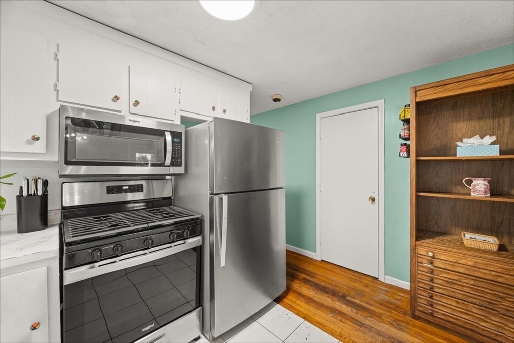 281 Megan Road Barnstable, MA 02601 - Photo 13 of 36 a kitchen with stainless steel appliances a refrigerator stove and microwave