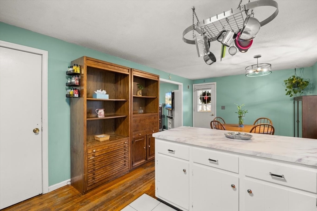 281 Megan Road Barnstable, MA 02601 - Photo 14 of 36 a bedroom with a bed and a chandelier