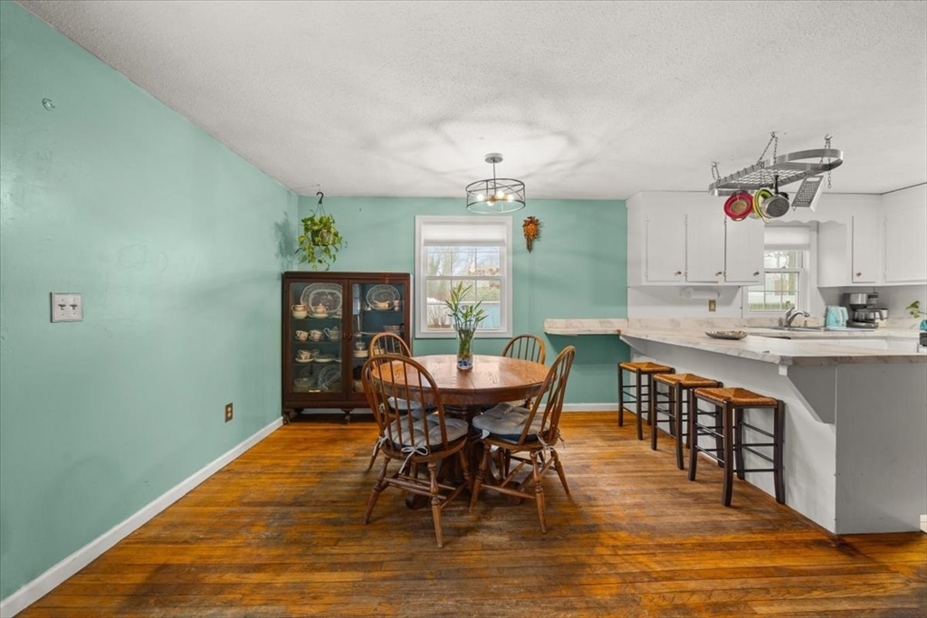 281 Megan Road Barnstable, MA 02601 - Photo 19 of 36 a view of a dining room with furniture and wooden floor