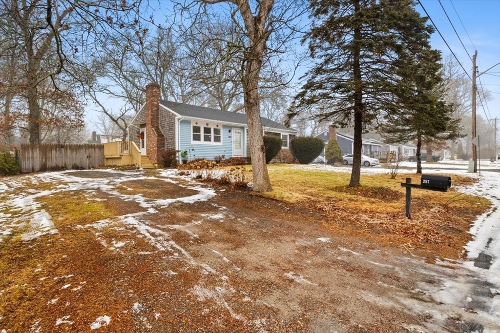 281 Megan Road Barnstable, MA 02601 - Photo 20 of 36 a street view with residential houses