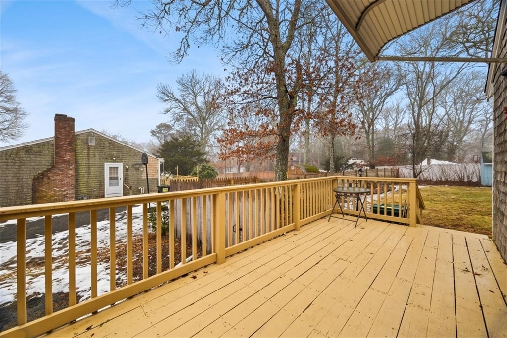 281 Megan Road Barnstable, MA 02601 - Photo 21 of 36 a view of a balcony with wooden floor and fence