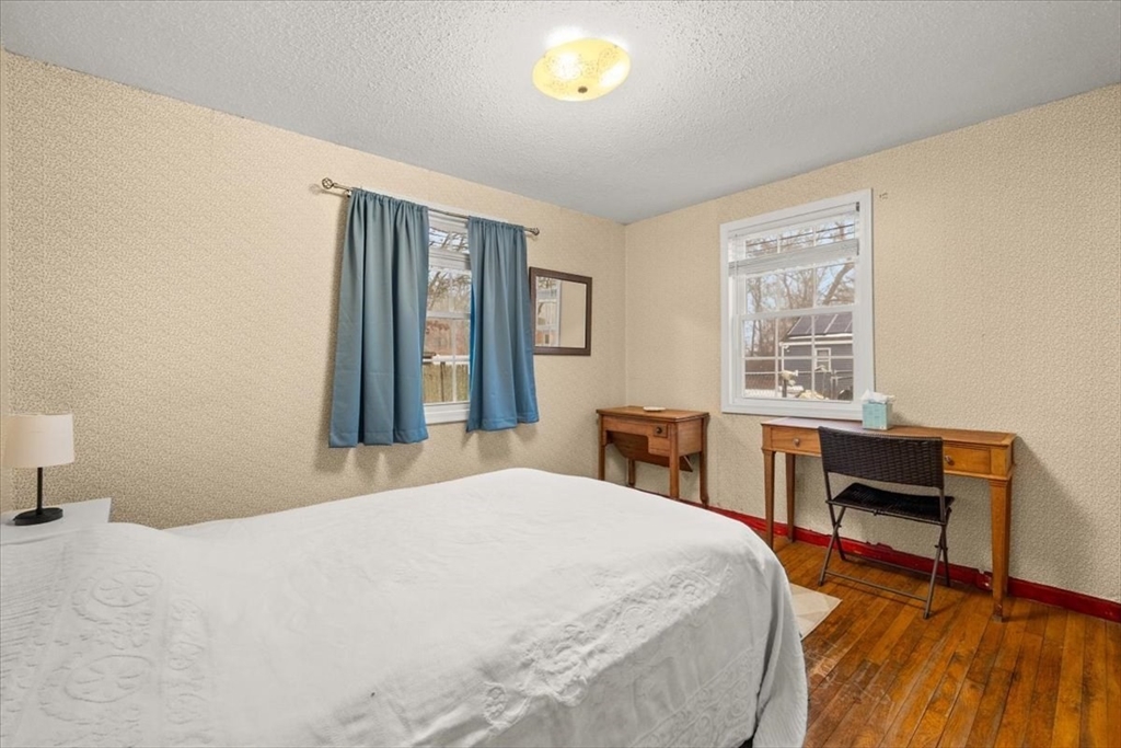 281 Megan Road Barnstable, MA 02601 - Photo 23 of 36 a bedroom with a bed and a desk