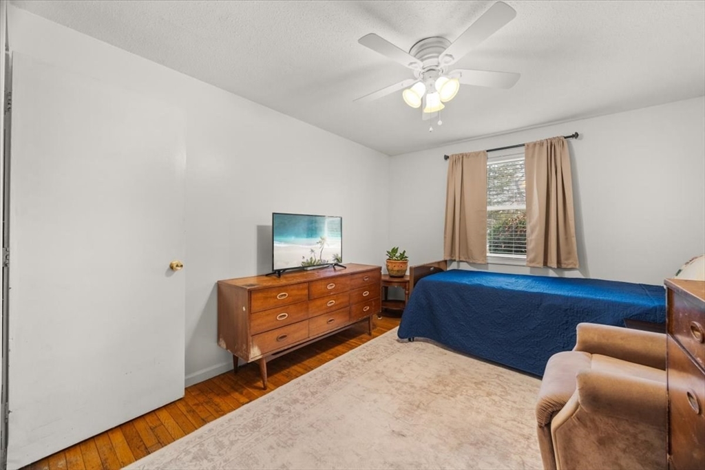 281 Megan Road Barnstable, MA 02601 - Photo 28 of 36 a living room with furniture and a chandelier