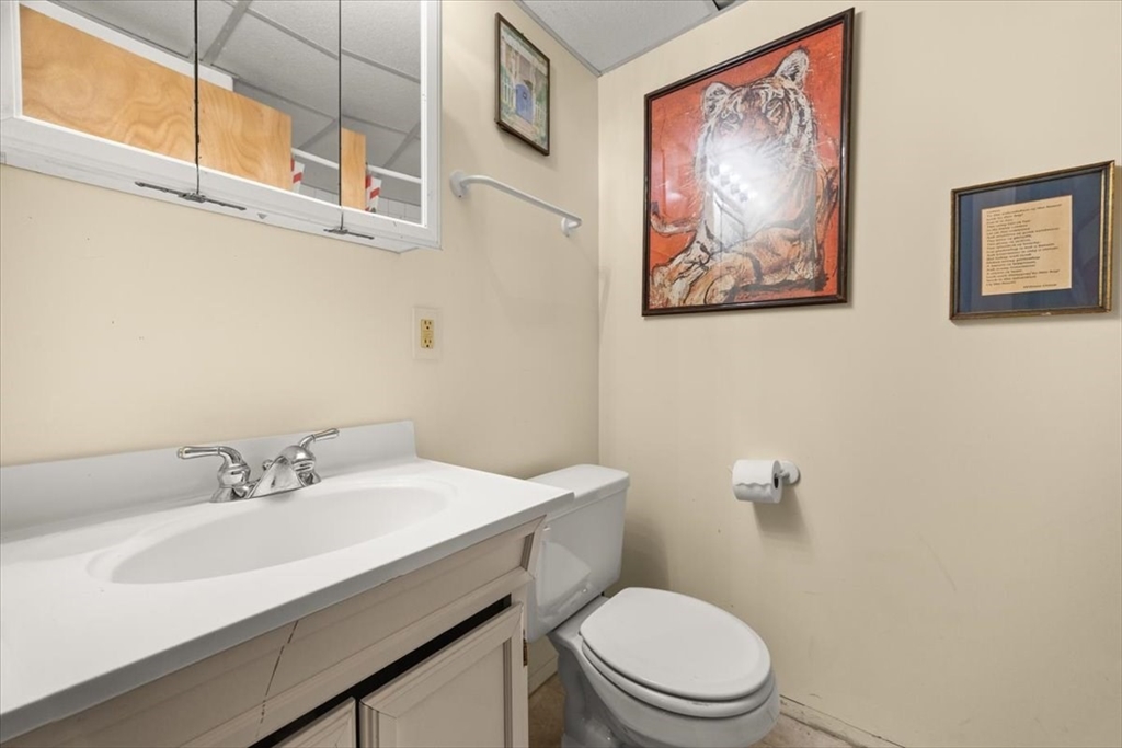 281 Megan Road Barnstable, MA 02601 - Photo 33 of 36 a bathroom with a sink mirror and toilet