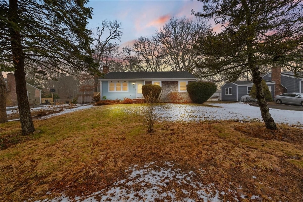 281 Megan Road Barnstable, MA 02601 - Photo 4 of 36 a backyard of a house with yard and outdoor seating