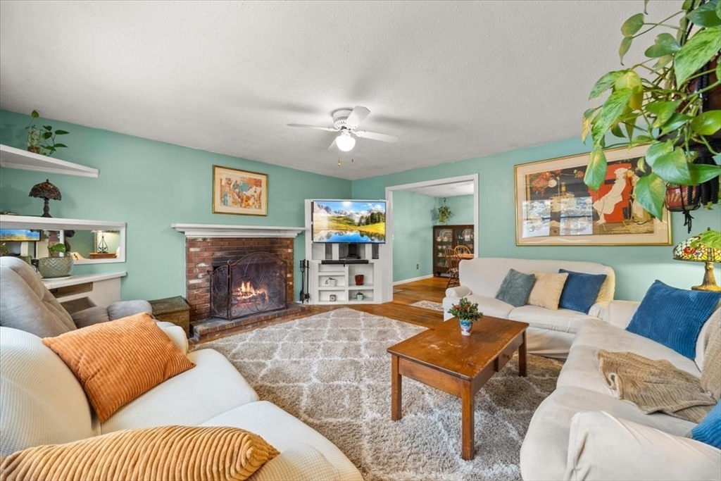 281 Megan Road Barnstable, MA 02601 - Photo 5 of 36 a living room with furniture fireplace and a window
