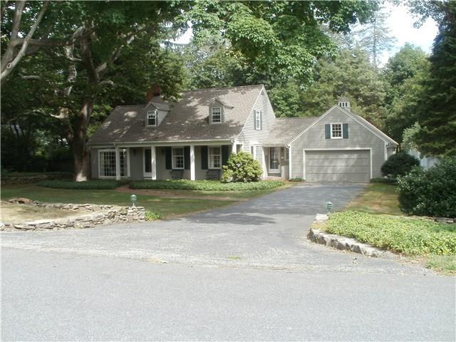 166 Old Mill Road Fairfield, CT 06824 - Photo 1 of 1 a front view of a house with a garden