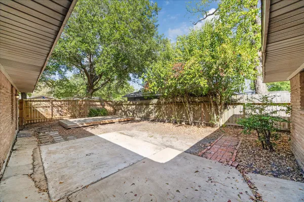 a view of a backyard of the house