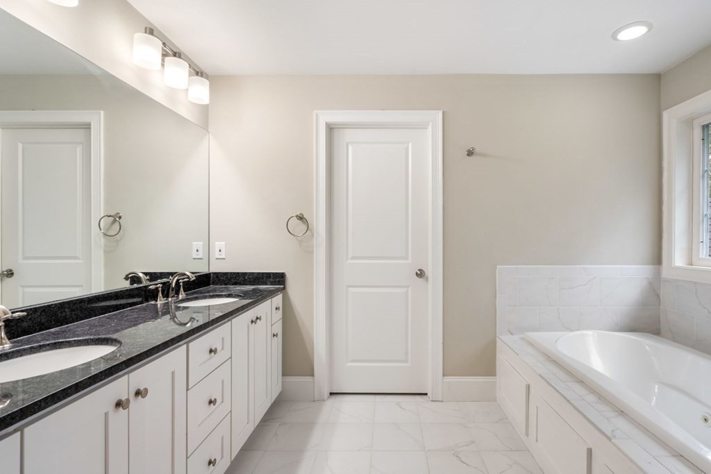 5 Bennett Road Wayland, MA 01778 - Photo 14 of 28 a spacious bathroom with a granite countertop sink and a bathtub