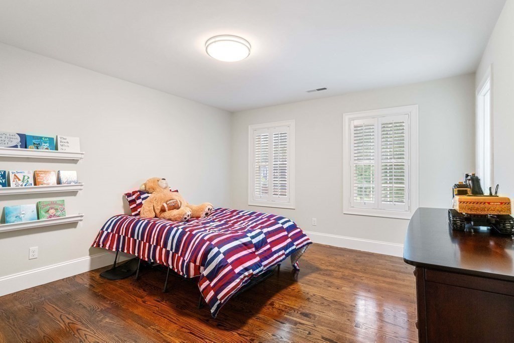 5 Bennett Road Wayland, MA 01778 - Photo 16 of 28 a bedroom with a bed and a window