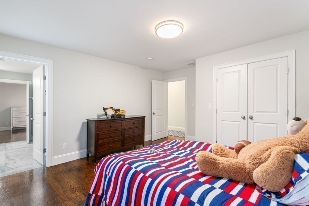 5 Bennett Road Wayland, MA 01778 - Photo 17 of 28 a bedroom with a bed and a closet
