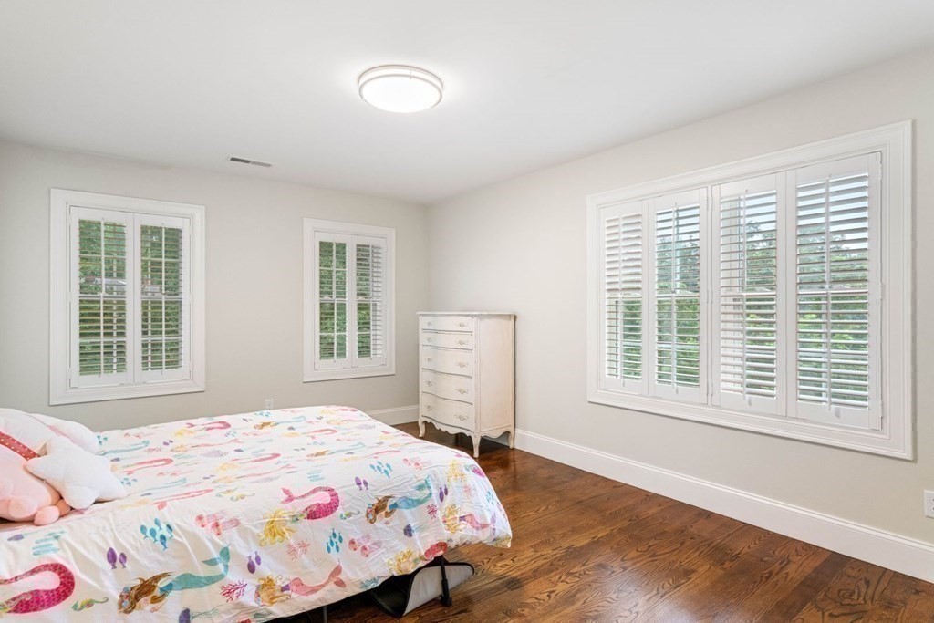 5 Bennett Road Wayland, MA 01778 - Photo 19 of 28 a bedroom with a bed next to a window