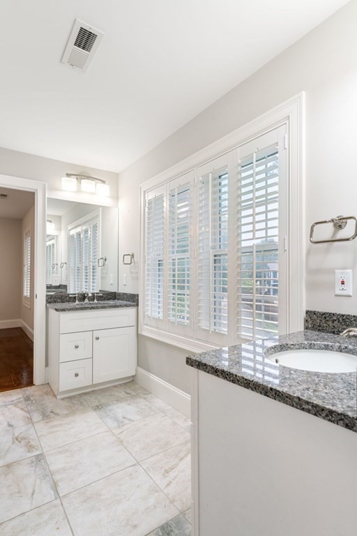 5 Bennett Road Wayland, MA 01778 - Photo 20 of 28 a large bathroom with a granite countertop sink and a large mirror