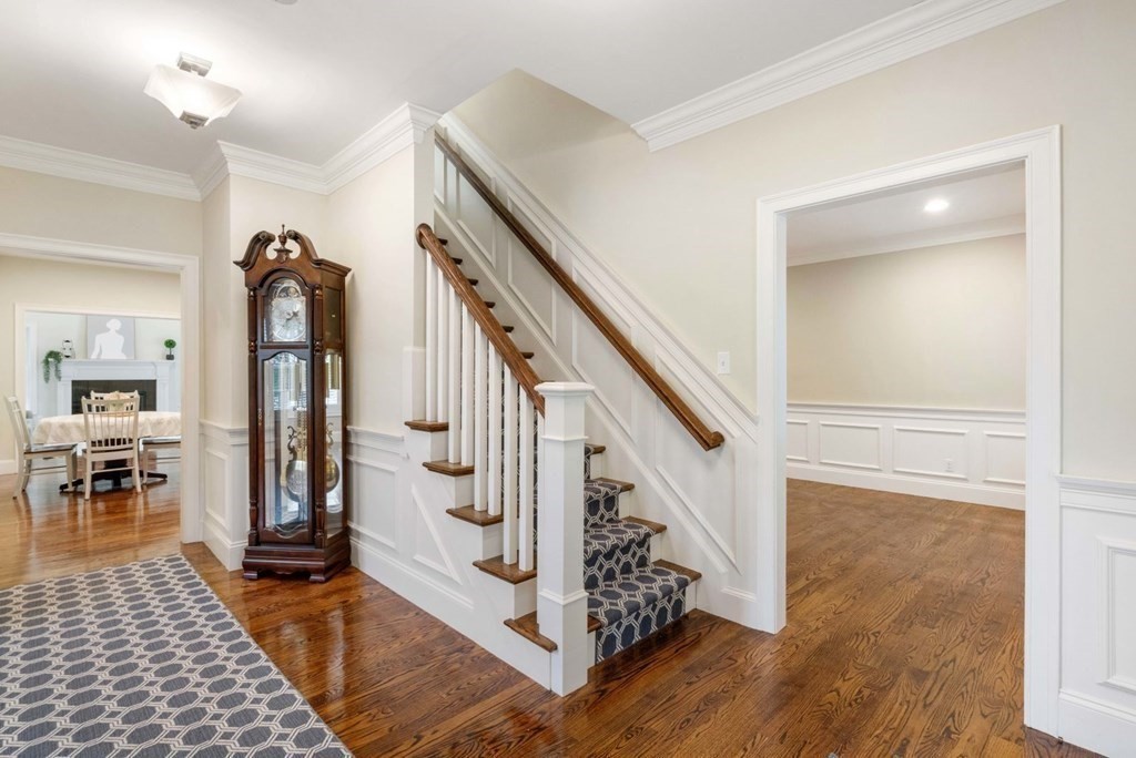 5 Bennett Road Wayland, MA 01778 - Photo 3 of 28 a view of hallway with stairs and wooden floor