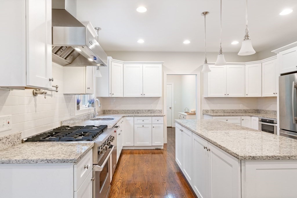 5 Bennett Road Wayland, MA 01778 - Photo 5 of 28 a kitchen with a stove sink and cabinets