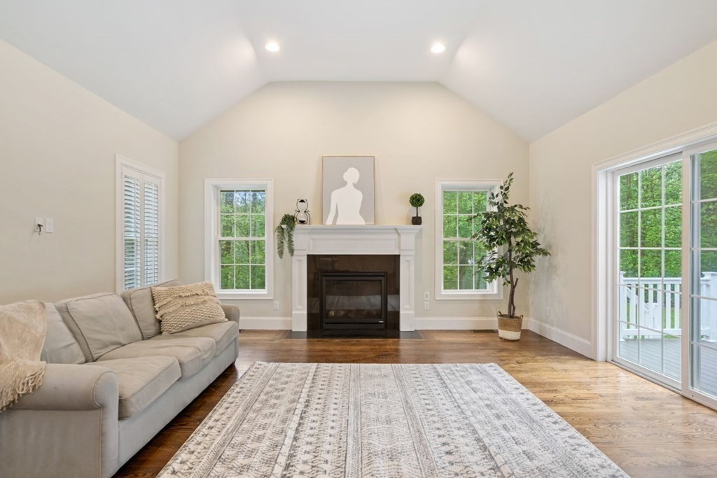 5 Bennett Road Wayland, MA 01778 - Photo 9 of 28 a living room with furniture and a fireplace