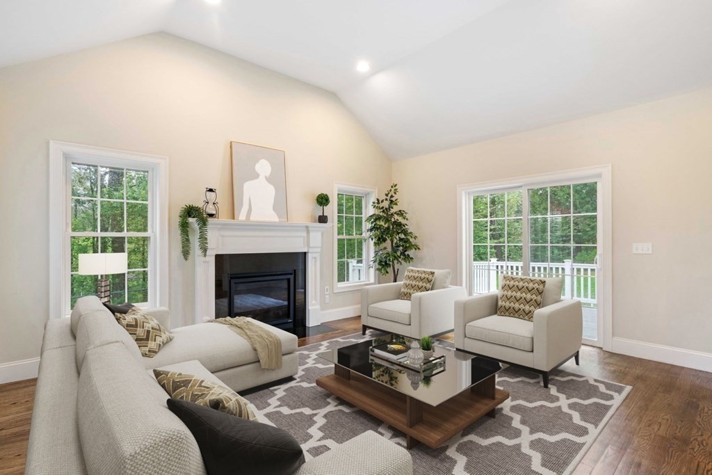 5 Bennett Road Wayland, MA 01778 - Photo 10 of 28 a living room with furniture and a fireplace